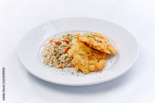 fried chicken breast with barley on the white background