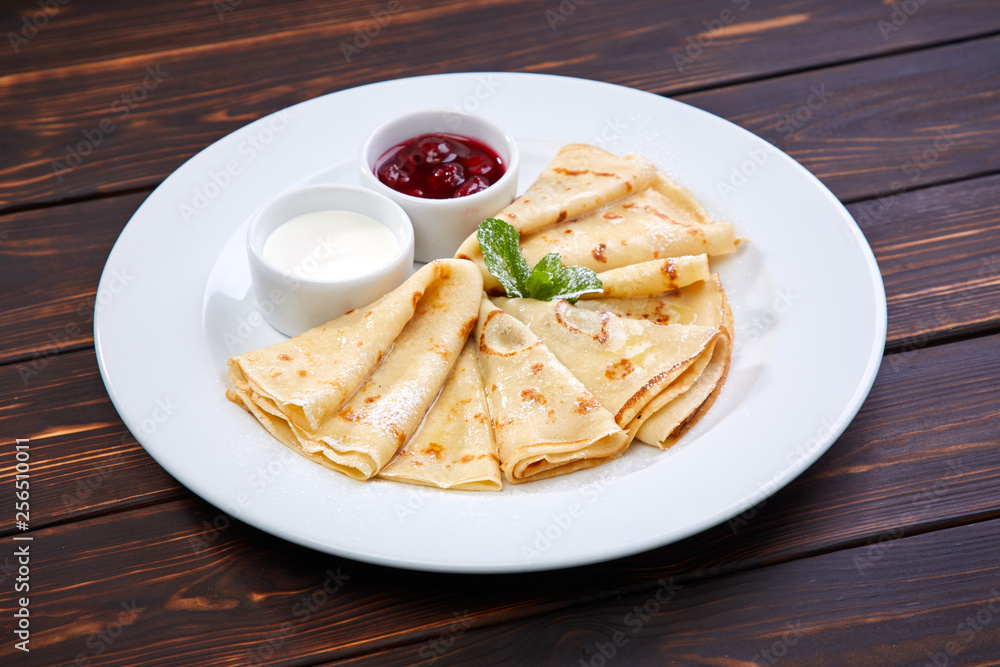 pancakes with sour cream and berry sauce pancakes with sour cream and berry sauce