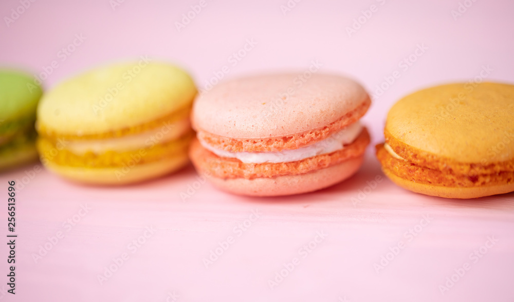 Multicolored macaroons on pink background. Multicolored macaroons on pink background.