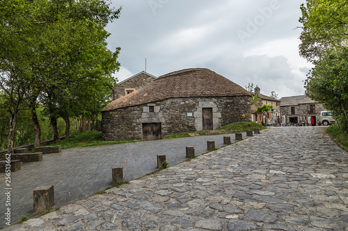 Pedrafita del Cebrero, Spain. Traditional Celtic house with a reed roof pallaza  photo