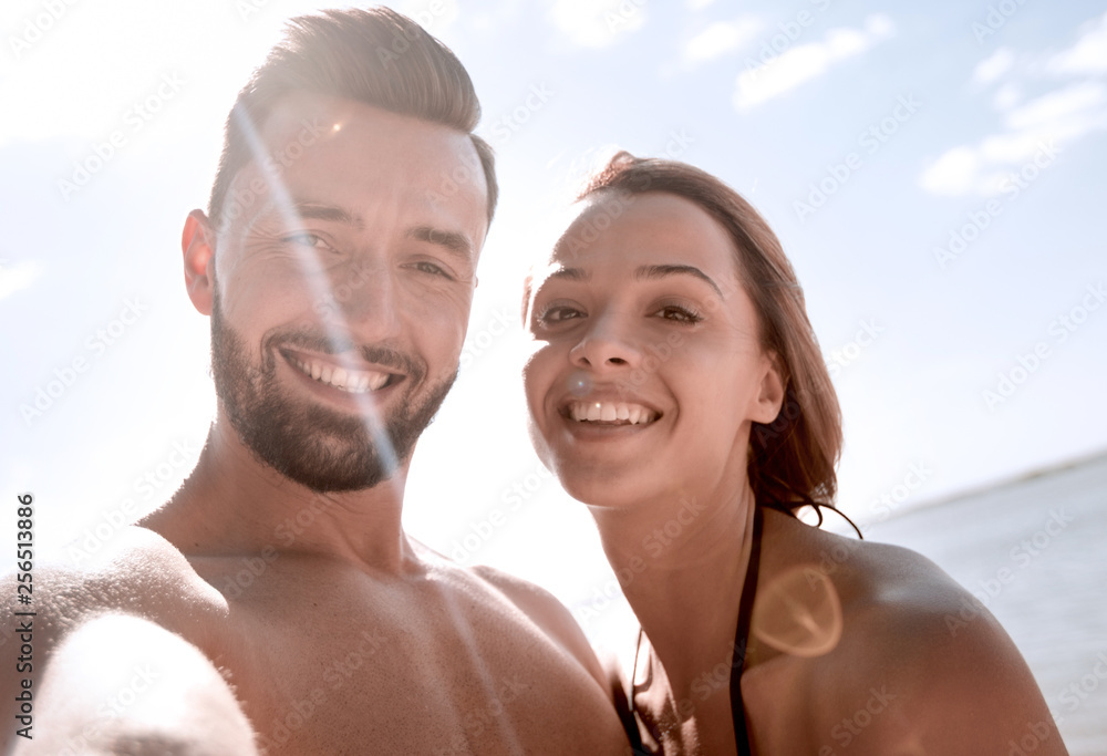 Fototapeta premium Happy couple spending carefree time on the beach outdoors.