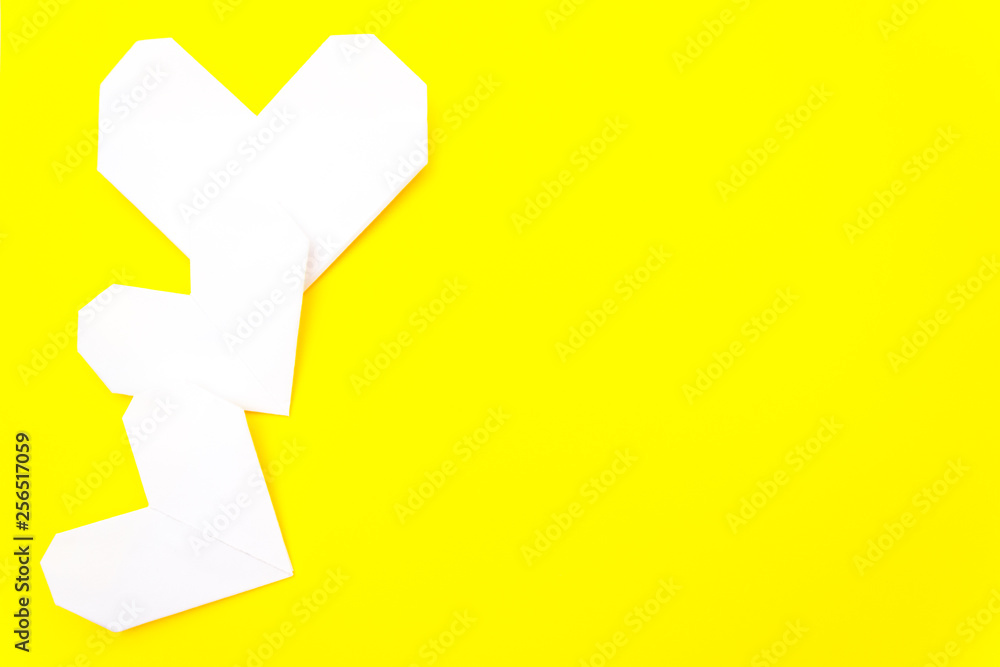 Fototapeta premium valentine's day card, origami heart, it is yellow. Copy space