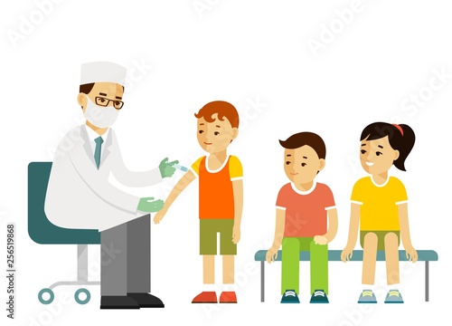 Children vaccination concept. Doctor pediatrician makes an injection of flu vaccine to a kid in hospital. Healthcare, medical treatment, prevention and immunize.