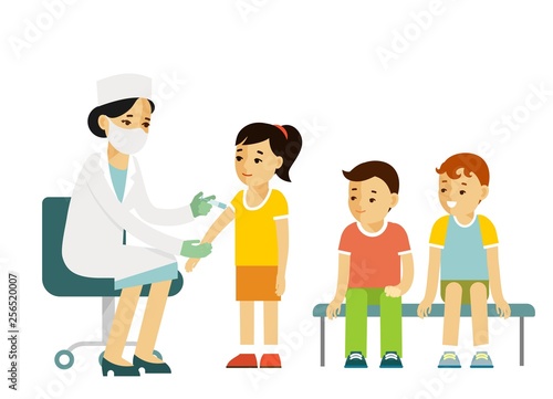 Children vaccination concept. Doctor pediatrician makes an injection of flu vaccine to a kid in hospital. Healthcare, medical treatment, prevention and immunize.