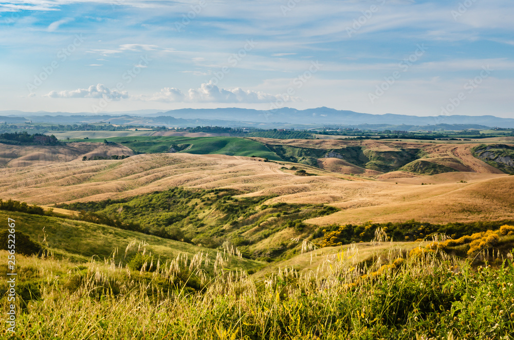 Fototapeta premium Tuscany landscape with hills, mountains and blue sky