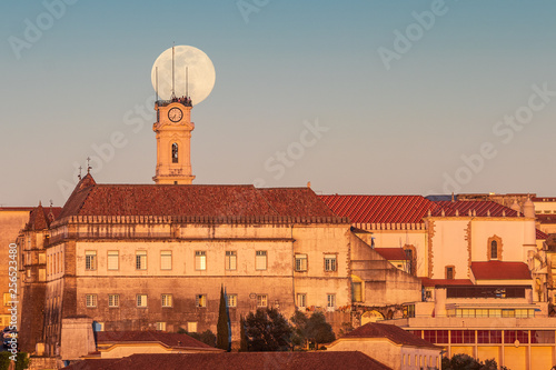 Coimbra, Portugal - March 20, 2019: Super moon with the university tower in the foreground.