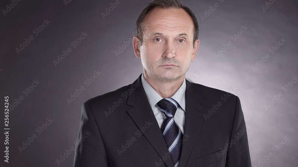 portrait of a modern businessman.isolated on black background portrait of a modern businessman.isolated on black background