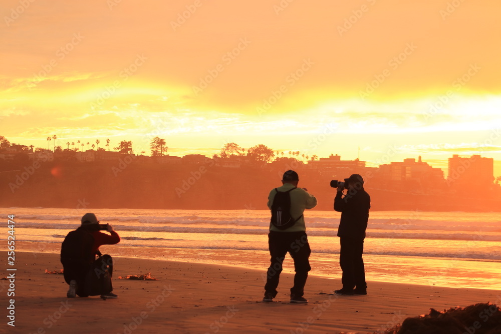 Photographer silhouette sunset beach 