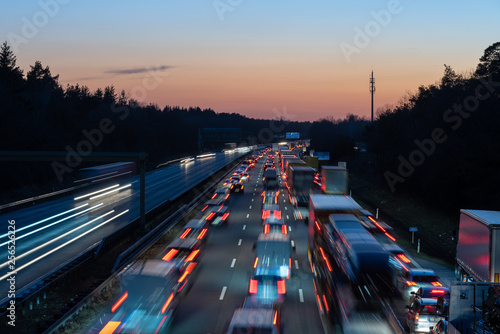 Traffic jam on highway during evening rush hour photo