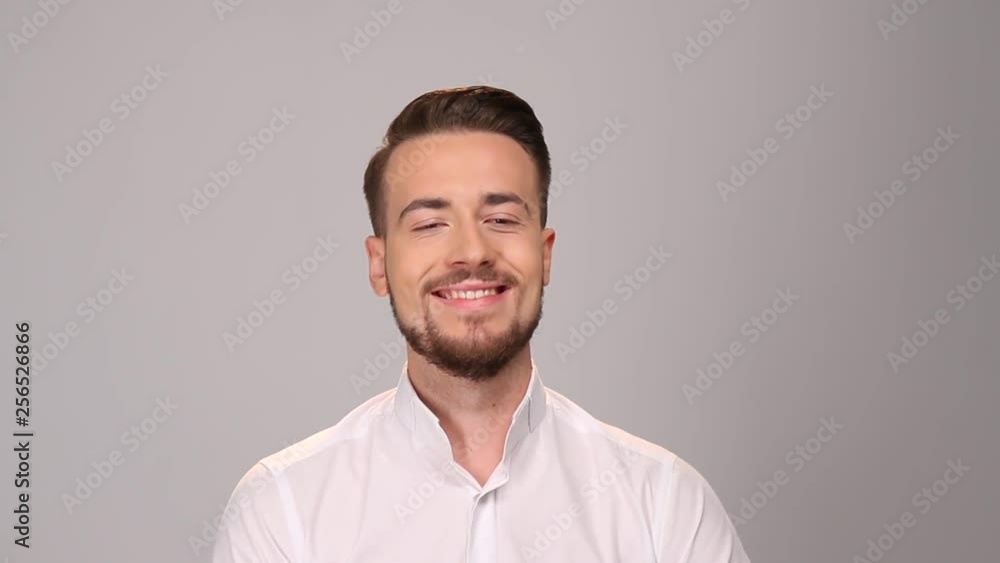 Man loking at camera and smiling. Portrait of happy fashionable handsome man Man loking at camera and smiling. Portrait of happy fashionable handsome man
