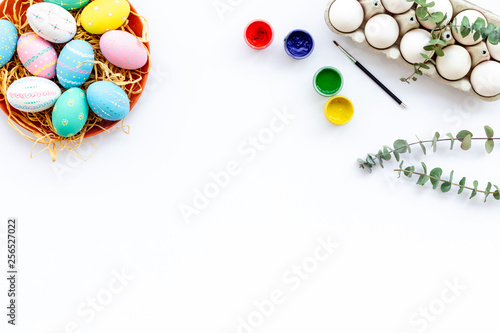 Traditional Easter eggs for paint on white background top view space for text