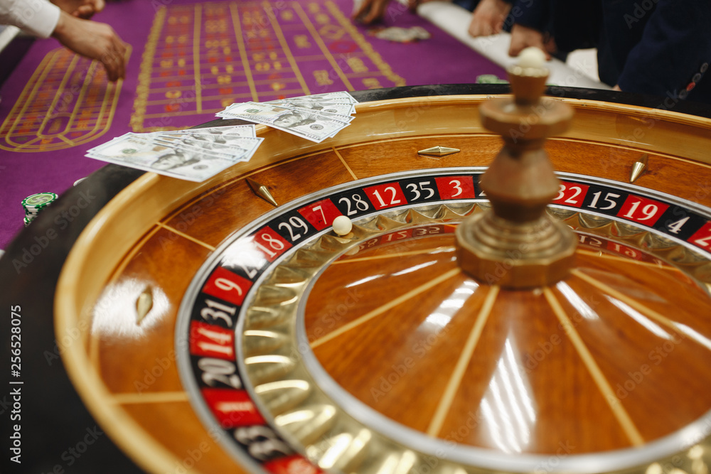 beautiful casino roulette close-up with playing chips beautiful casino roulette close-up with playing chips