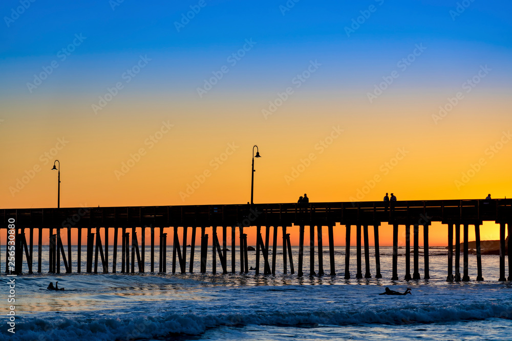 Silhouetted Pier at Sunset at Beach 