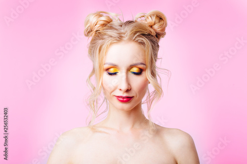 Young girl on a pink background