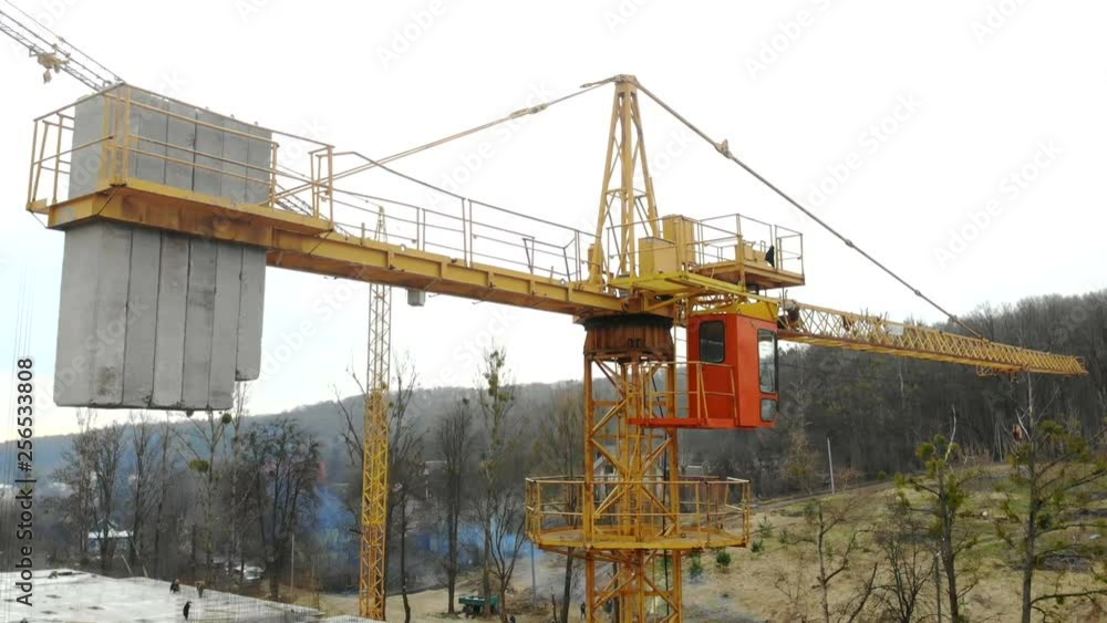 Aerial view big construction crane, close up. Construction crane on a building background, close up. Aerial view big construction crane, close up. Construction crane on a building background, close up.