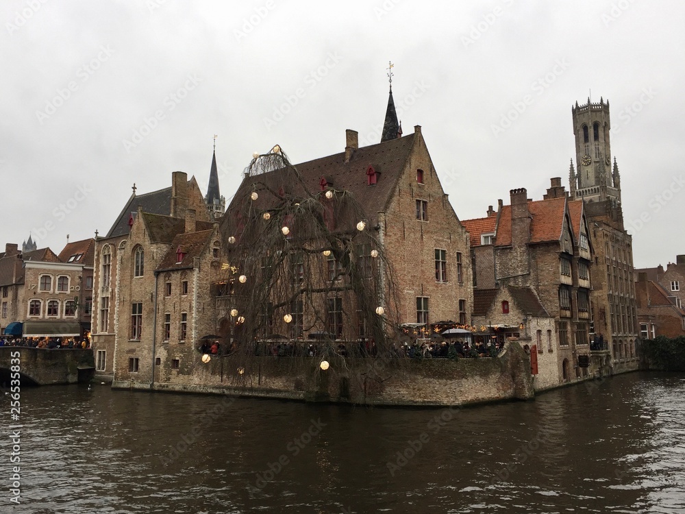 The Rozenhoedkaai (Quay of the Rosary) with the Belfry of Bruges in the background is the most photographed area of ​​Bruges, West Flanders, Belgium.
