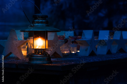 Kerosene lamp in the frosty night on the table