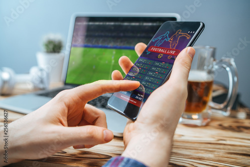 Photos Man celebrating victory after making bets at bookmaker website