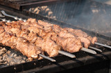 street food skewers, meat is fried on the fire, the process of cooking meat on the fire