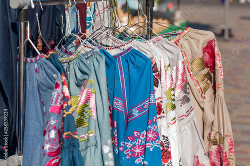 national Ukrainian clothes are sold at the fair, hanging on a hanger © Germanova Antonina