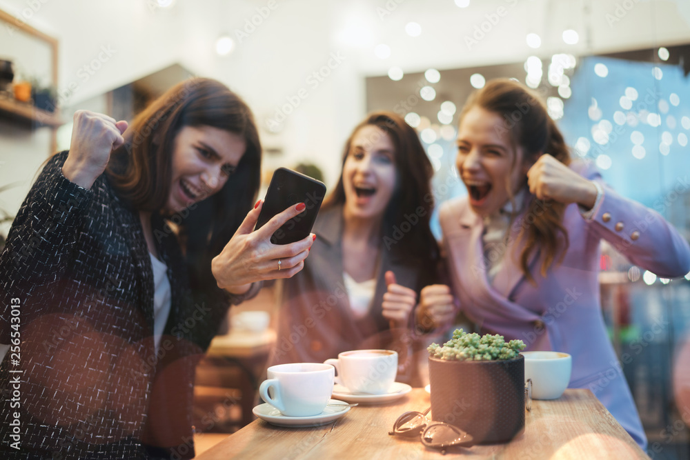 Girl celebrating money win after betting online Girl celebrating money win after betting online