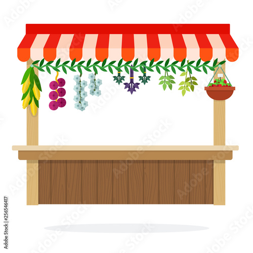 Counter of vegetable kiosk with suspended herbs, onion and corn flat isolated