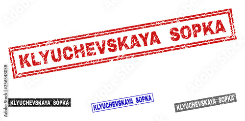Grunge KLYUCHEVSKAYA SOPKA rectangle stamp seals isolated on a white background. Rectangular seals with grunge texture in red, blue, black and grey colors.