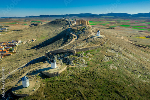 Consuegra castle and windmills aerial view with blue sky in La Mancha Spain famous Don Quixote site