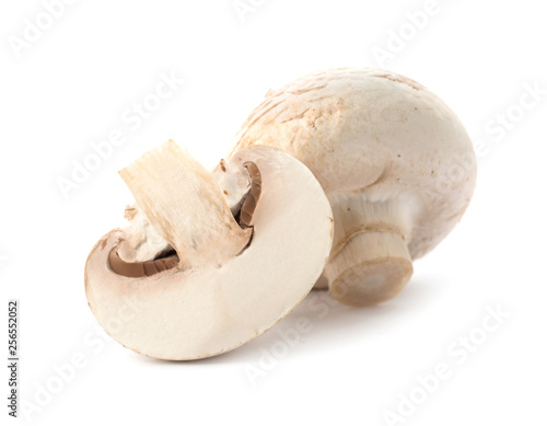 Fresh raw champignon mushrooms on white background