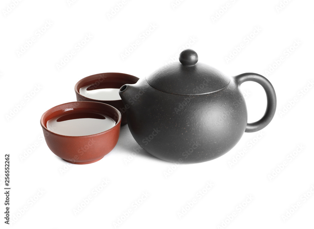Cups and teapot of freshly brewed oolong on white background Cups and teapot of freshly brewed oolong on white background