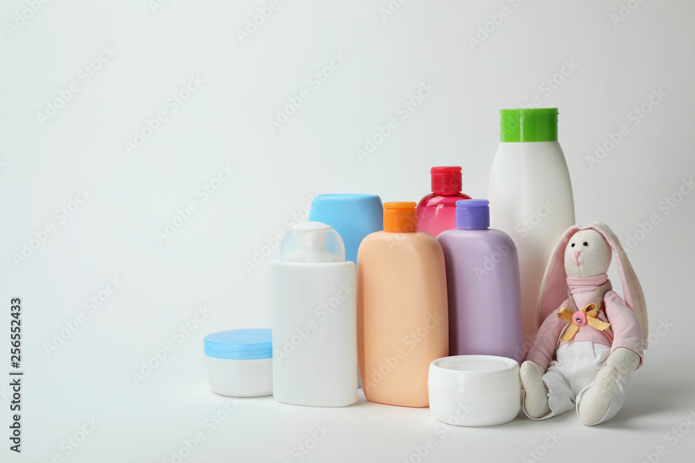 Baby cosmetic products and toy on white background Baby cosmetic products and toy on white background