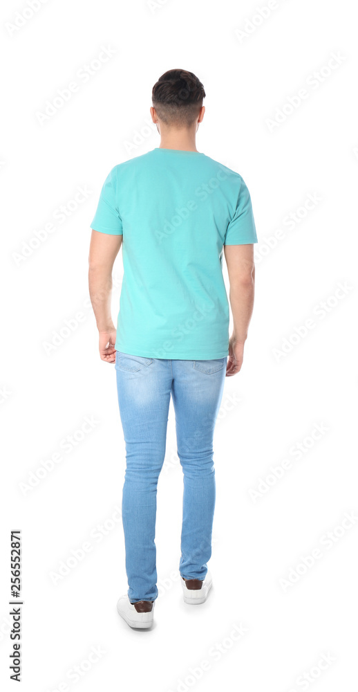 Young man in casual clothes posing on white background