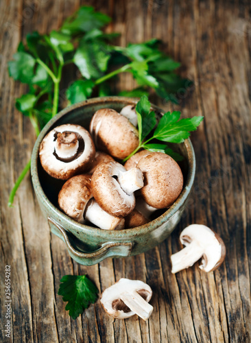 Fresh mushrooms on wooden background.