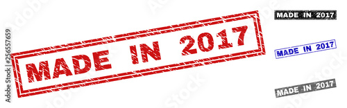 Grunge MADE IN 2017 rectangle stamp seals isolated on a white background. Rectangular seals with grunge texture in red, blue, black and grey colors.