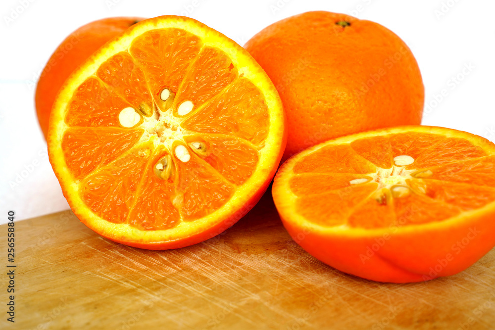 Close up of golden orange isolated on white background with copy and paste space Close up of golden orange isolated on white background with copy and paste space