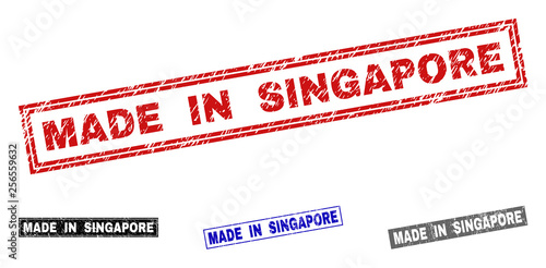 Grunge MADE IN SINGAPORE rectangle stamp seals isolated on a white background. Rectangular seals with distress texture in red, blue, black and grey colors.
