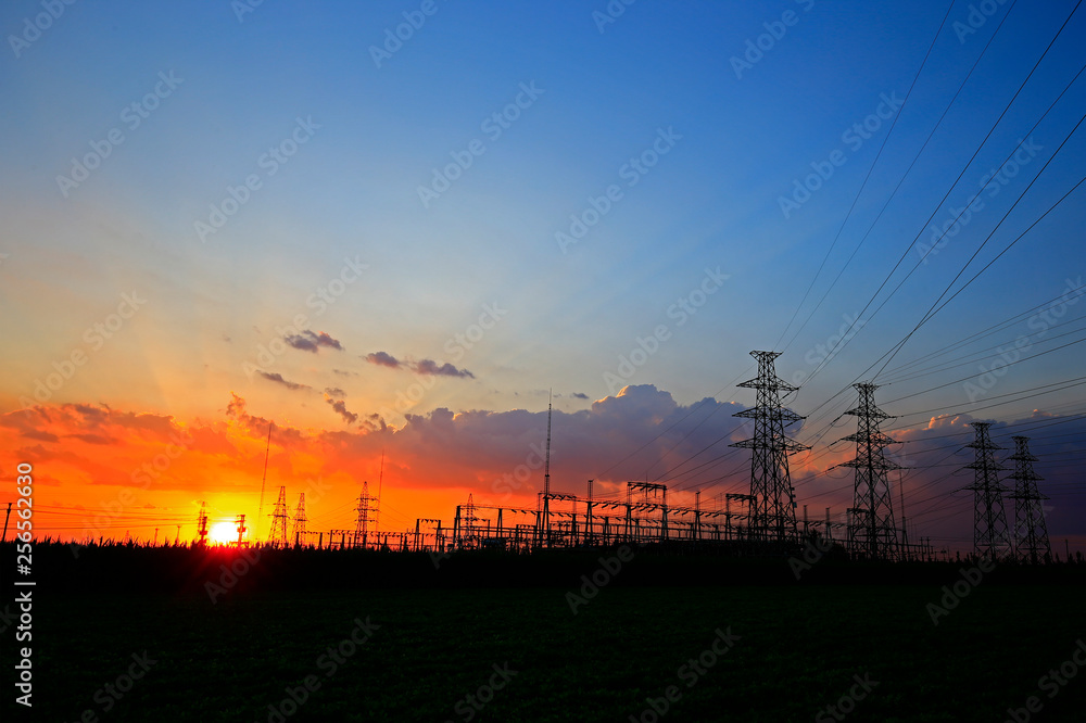 Electric tower, silhouette at sunset