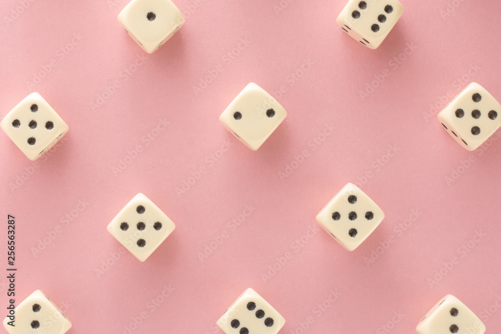 White gaming dices on pink background. victory chance and lucky. Flat lay style, place for text. Top view and Close-up cube. Concept business, gamble and game. Spectacular background pastel. White gaming dices on pink background. victory chance and lucky. Flat lay style, place for text. Top view and Close-up cube. Concept business, gamble and game. Spectacular background pastel.
