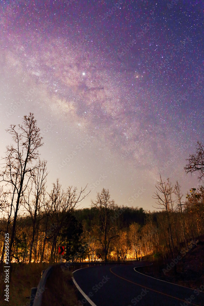  The Rural road on a milky way galaxy and muntain in the beautiful night sky at Chiangmai province of Thailand