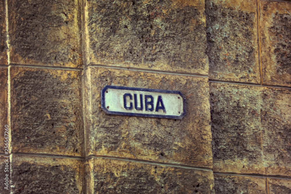 Αυτοκόλλητο Street sign in Havana with the name Cuba over a  wall