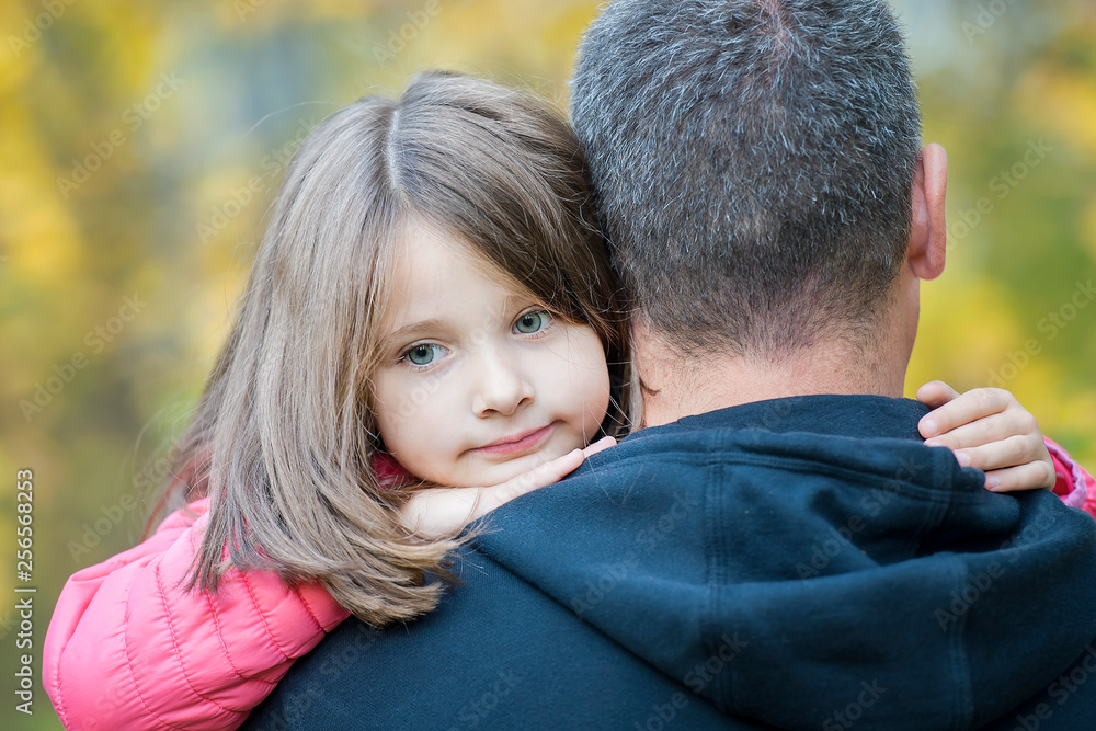 Portrait of one sad daughter hugging her father Portrait of one sad daughter hugging her father