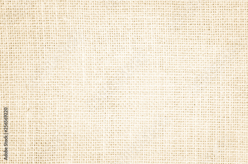 Cream abstract Hessian or sackcloth fabric or hemp sack texture background.