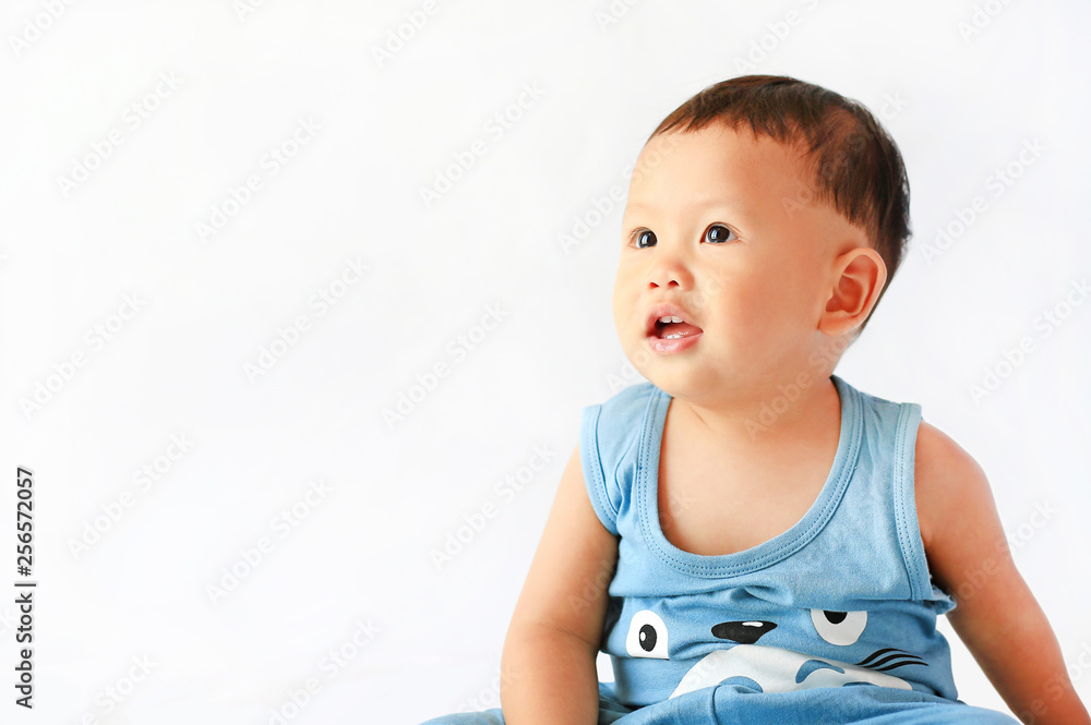 Baby boy portrait looking up on white background. Baby boy portrait looking up on white background.