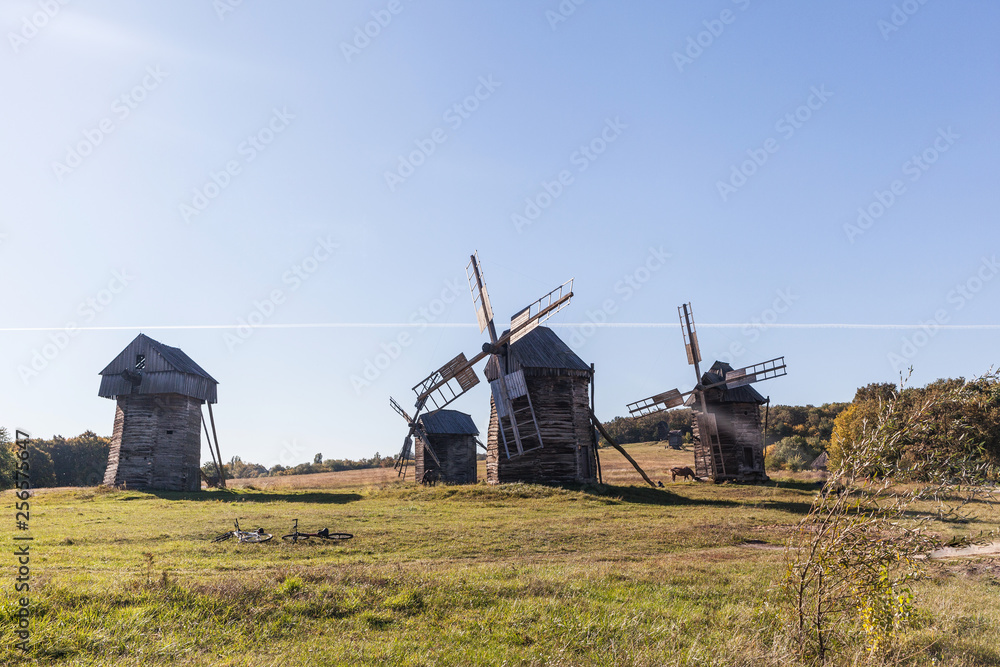 Fototapeta premium windmill in the steppe, old straw hut, beautiful nature, desktop wallpaper