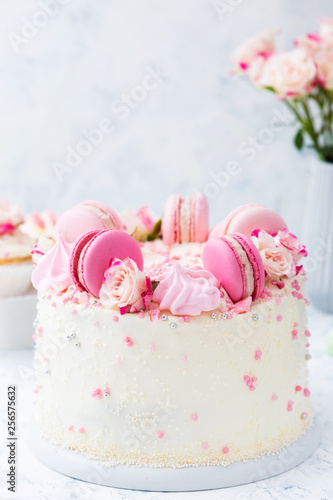 Wedding white cake with macarons and roses
