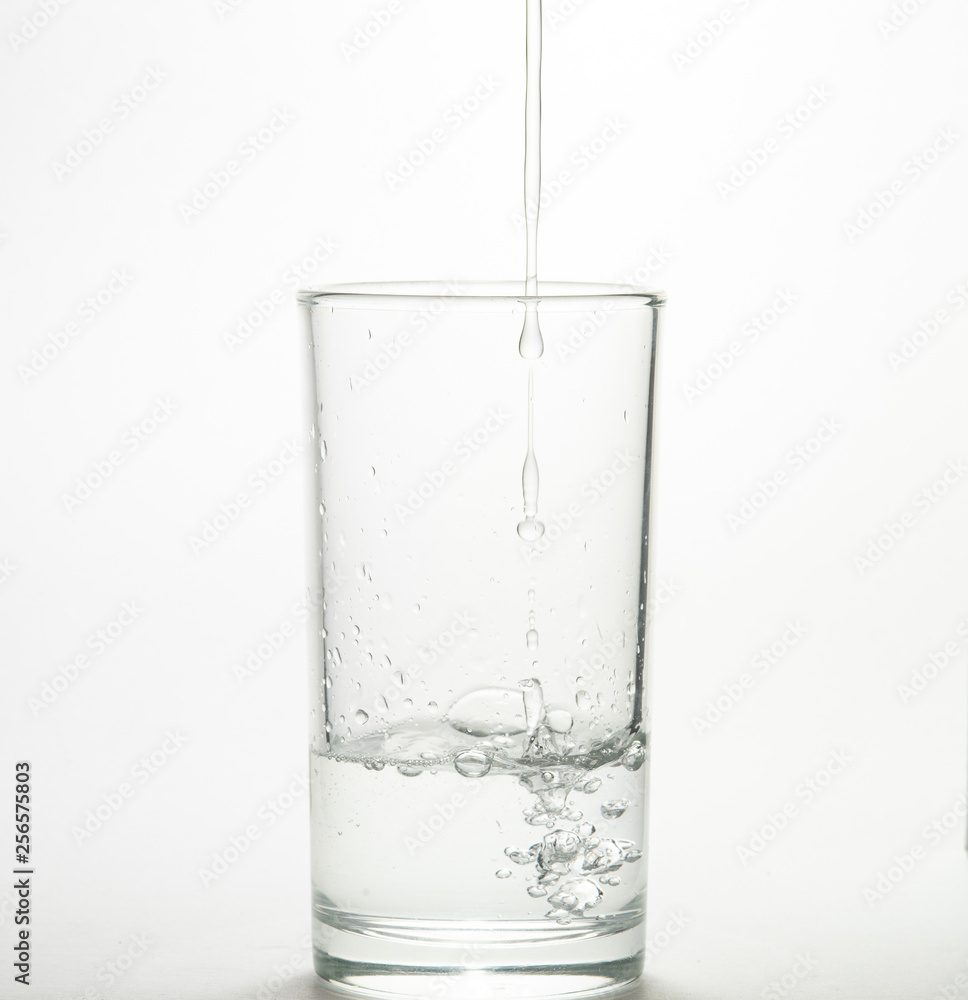 Close up pouring purified fresh drink water from the bottle Close up pouring purified fresh drink water from the bottle