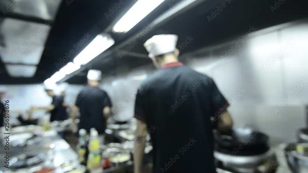 Blurred kitchen staff working scene Blurred kitchen staff working scene