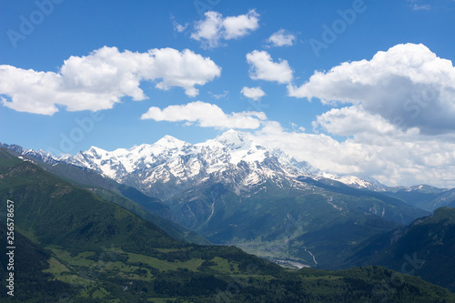 Caucasus mountains landscape in Georgia  Svaneti. Snowy mountain summit on clear summer day