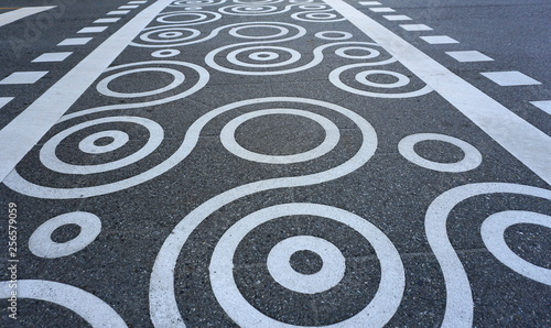 Creative pedestrian crossing road marking top view.