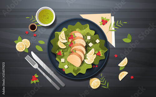 healthy fresh vegetable salad with chicken and sauce in black bowl top angle view restaurant food composition concept knife fork and napkin dark background horizontal